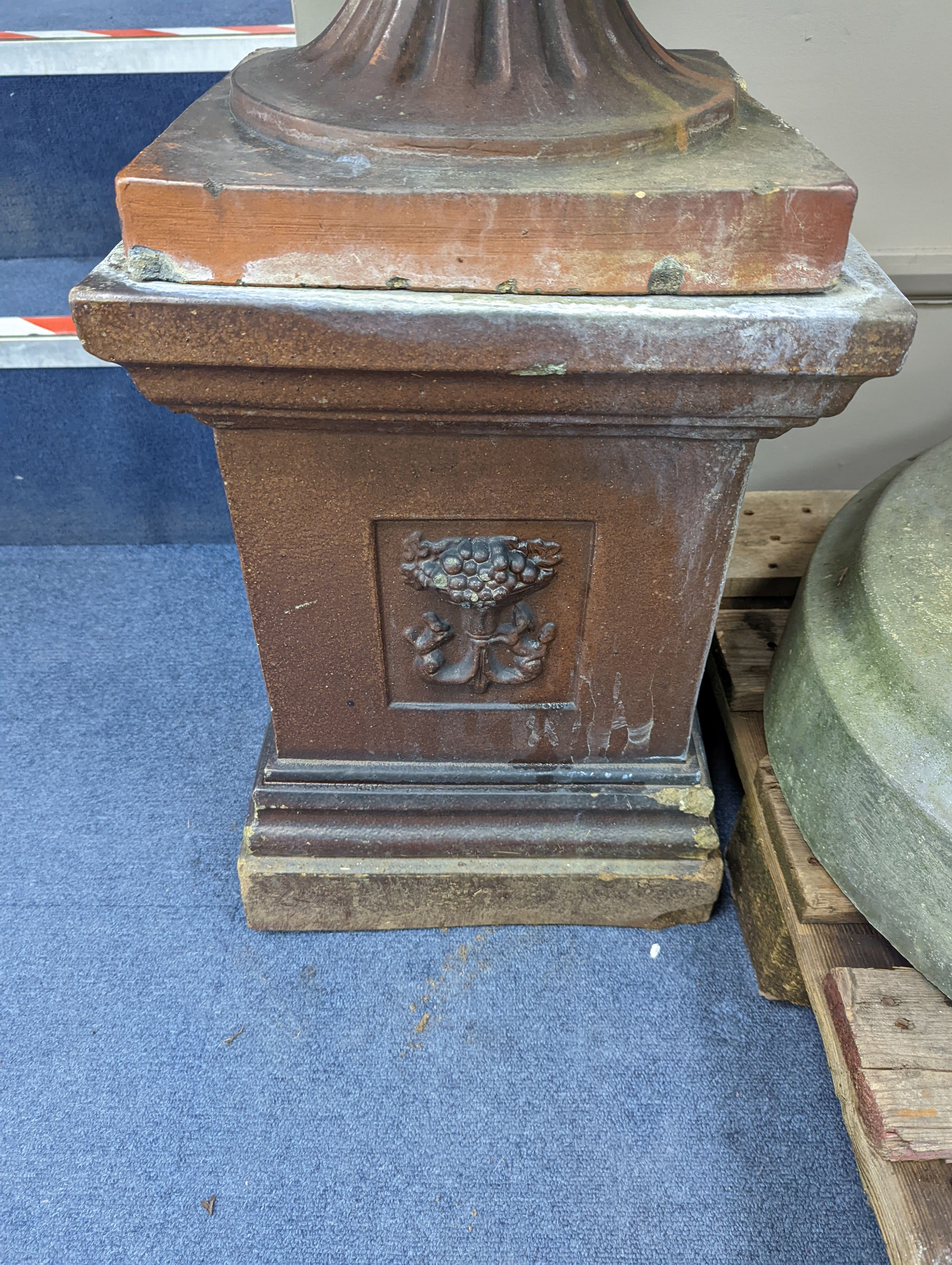 A Victorian glazed earthenware campana garden urn on square plinth, height 99cm